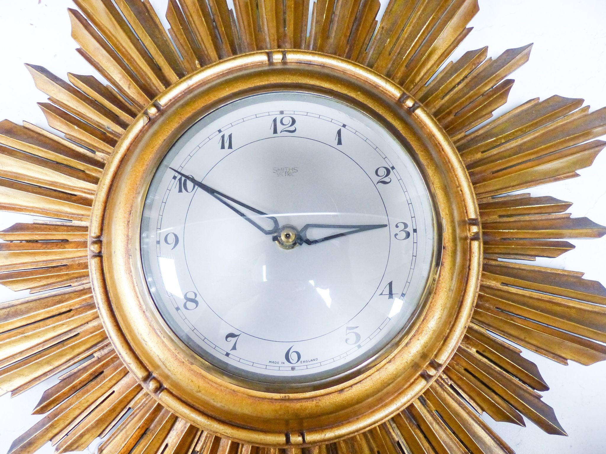 A gilt painted sunburst wall clock 50cm